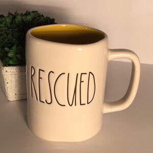 Rae Dunn RESCUED mug white,black lettering , yellow inside